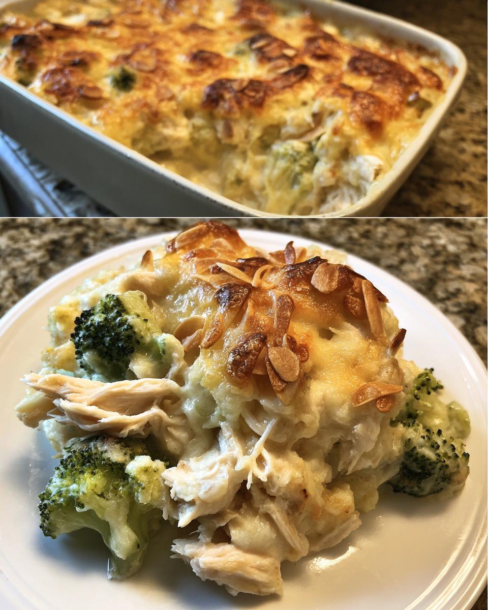 A serving of creamy Chicken Divan featuring shredded chicken, broccoli florets, and a golden, cheesy topping with toasted almonds.