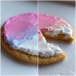 Close-up of a sugar cookie topped with thick, multi-toned royal icing recipe frosting in pink, blue, and white.